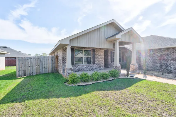 a view of a backyard of the house