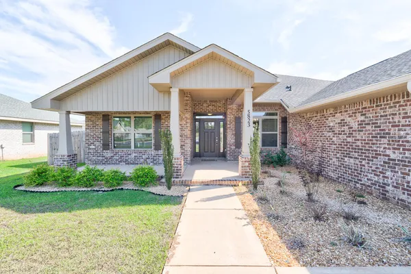 a view of a house with a park