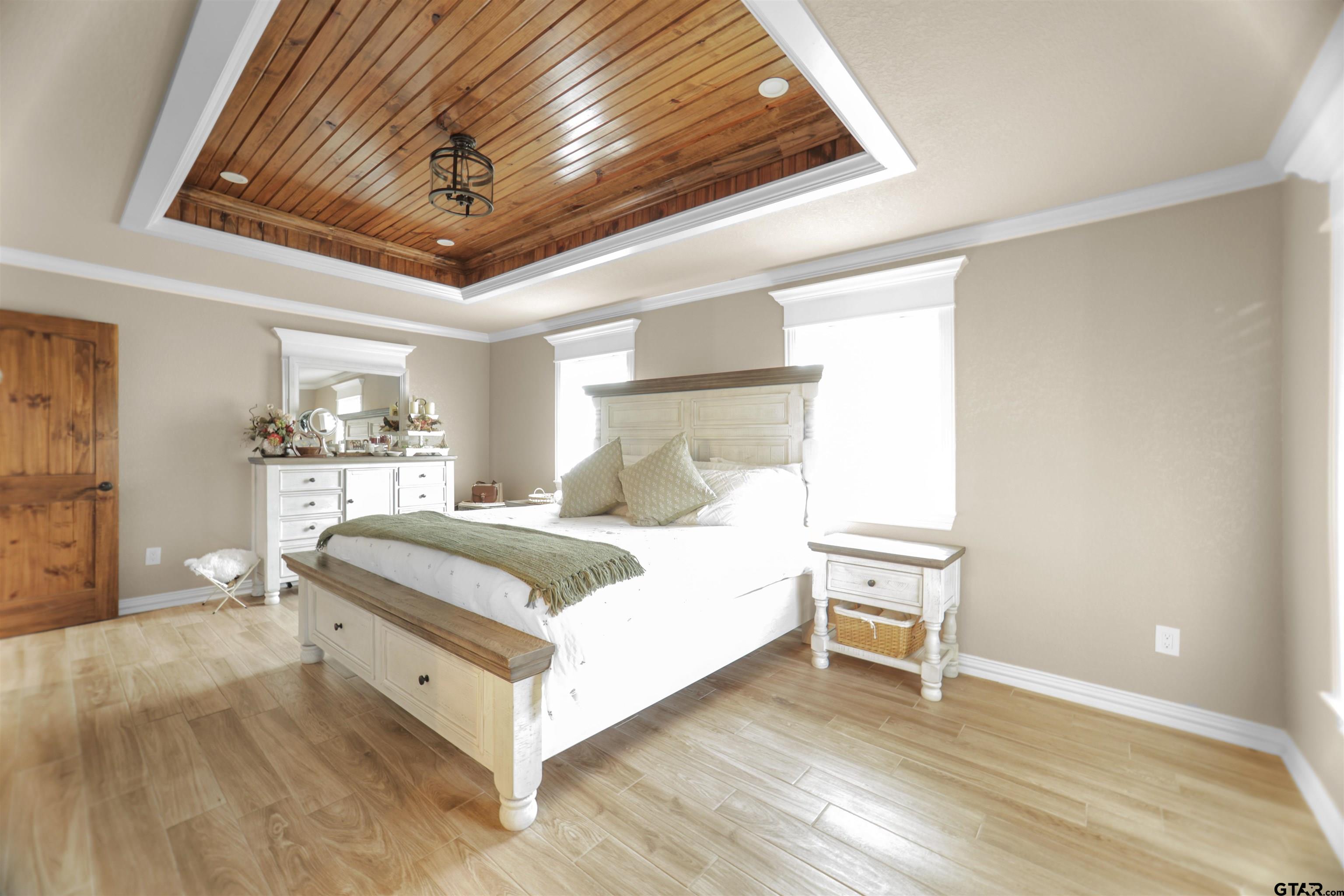 11931 State Highway 64 Tyler, TX 75704 - Photo 12 of 44 a bedroom with a bed and a table in it