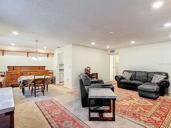 a living room with furniture and a table