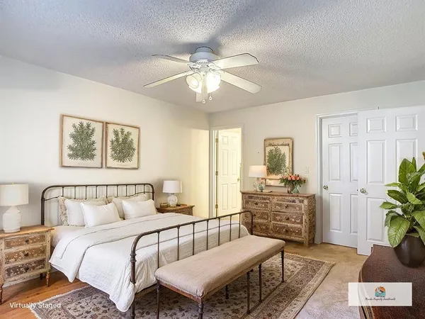 a bedroom with furniture and a chandelier