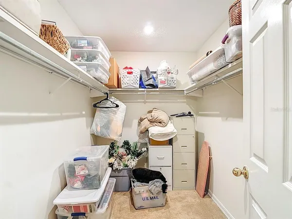 a bathroom with a sink vanity granite toilet and shower