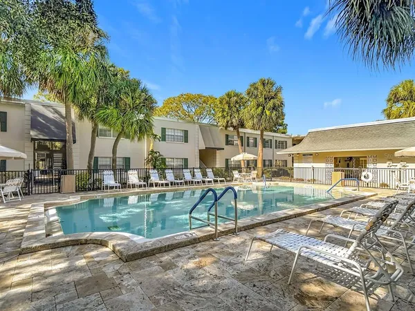 a view of a swimming pool with a patio