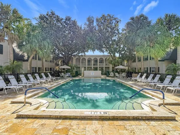 an aerial view of a house with a yard swimming pool outdoor seating and yard