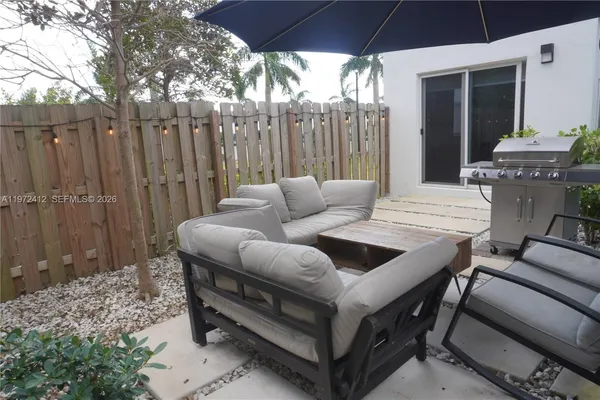 a living room with furniture a table and chairs