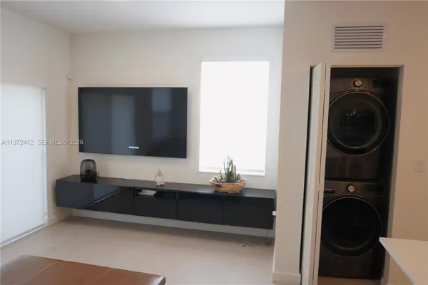 a living room with a couch and a flat screen tv