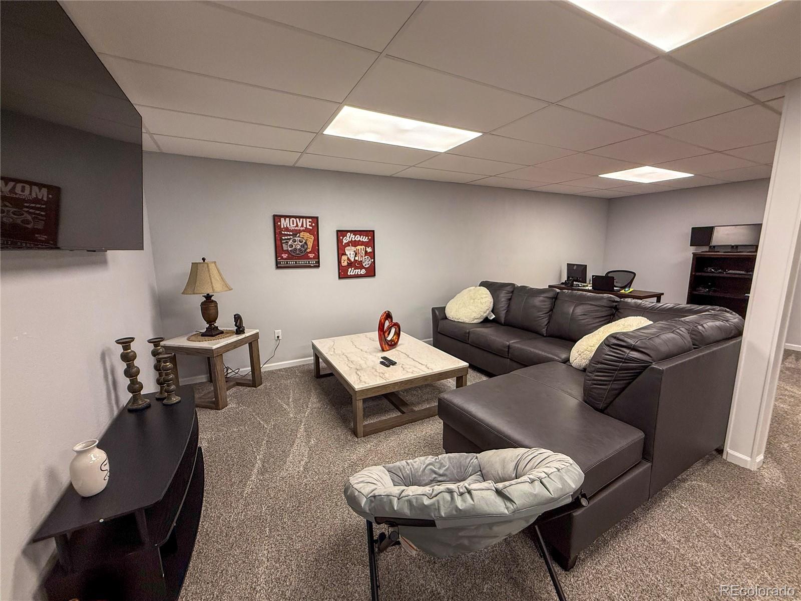 370 West 8th Street North, Unit A & B Cheyenne Wells, CO 80810 - Photo 15 of 47 a living room with furniture and wooden floor