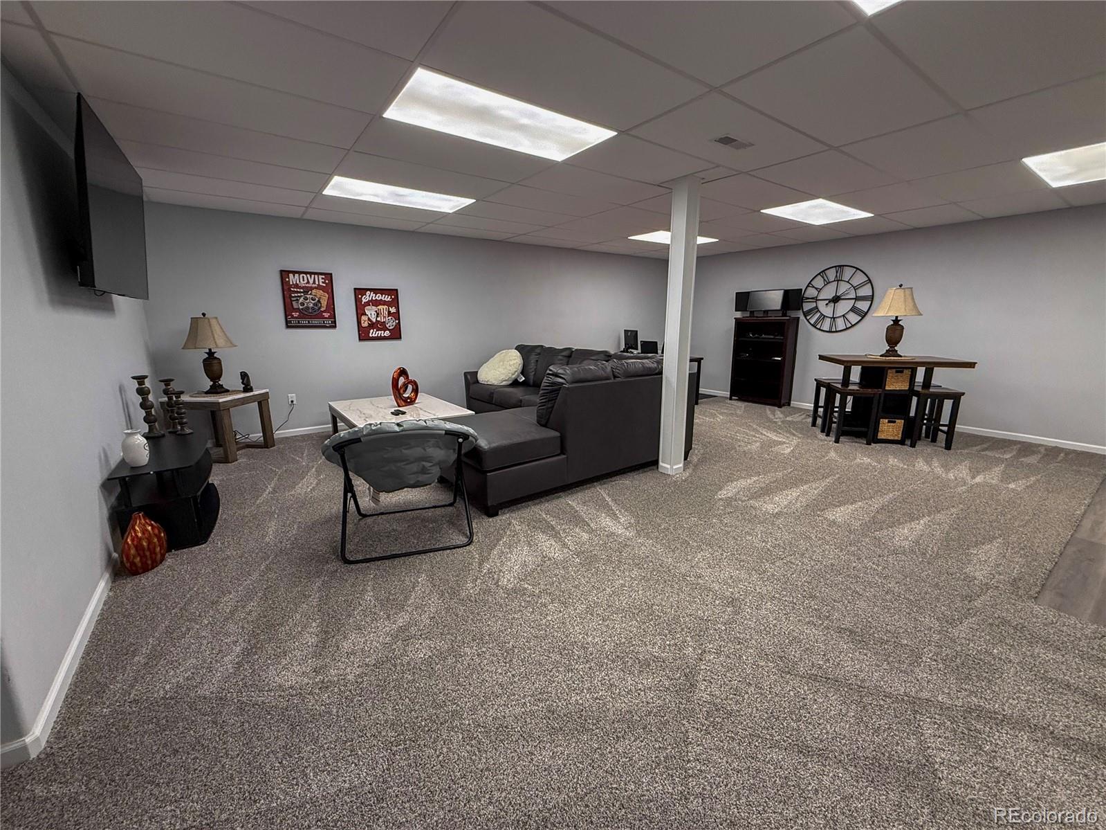 370 West 8th Street North, Unit A & B Cheyenne Wells, CO 80810 - Photo 16 of 47 a living room with furniture and a flat screen tv