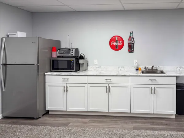 a kitchen with cabinets and white appliances