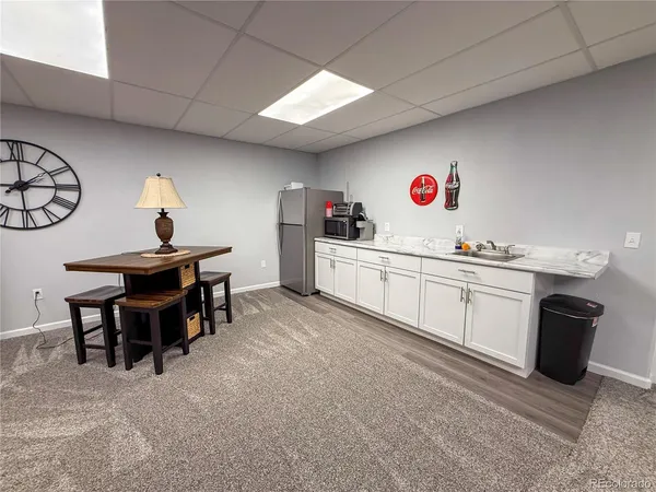 a kitchen with a sink and a stove top oven