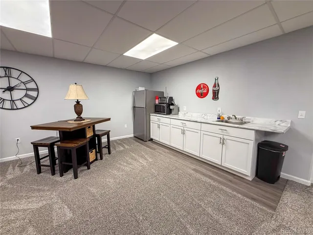 a kitchen with a sink and a stove top oven