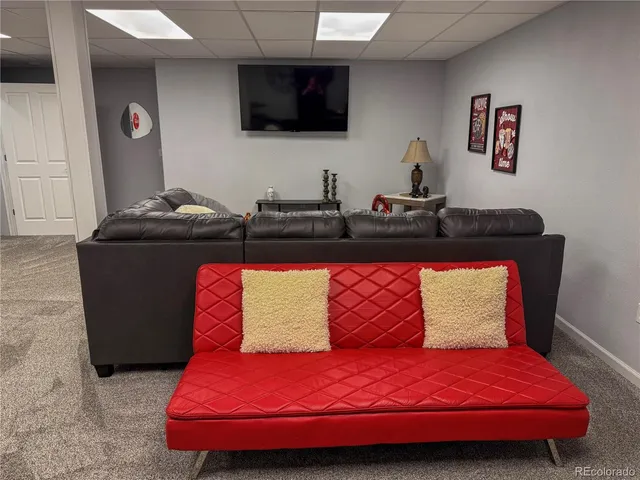 a bedroom with a bed and flat screen tv