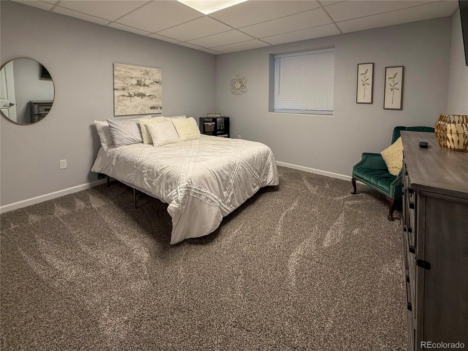 370 West 8th Street North, Unit A & B Cheyenne Wells, CO 80810 - Photo 20 of 47 a bedroom with a bed and painting on the wall