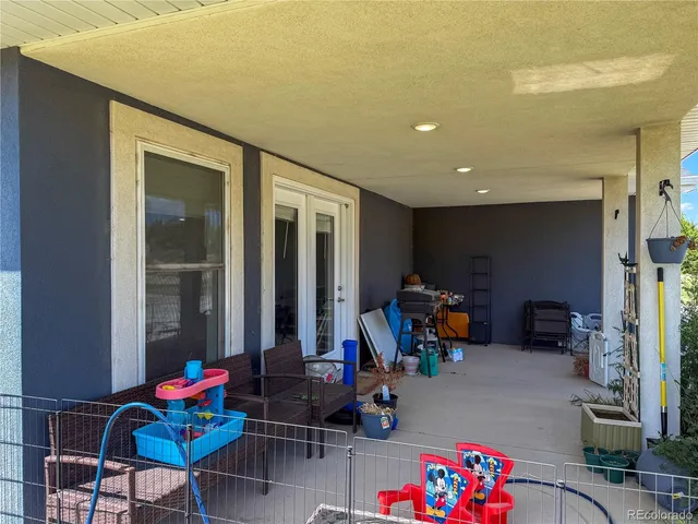 a large kitchen with a large window and stainless steel appliances