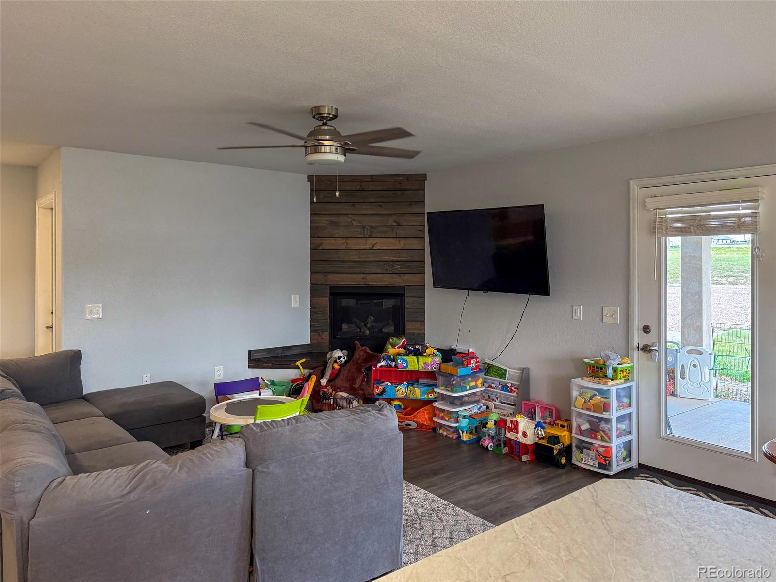 370 West 8th Street North, Unit A & B Cheyenne Wells, CO 80810 - Photo 30 of 47 a children room with furniture and a flat screen tv