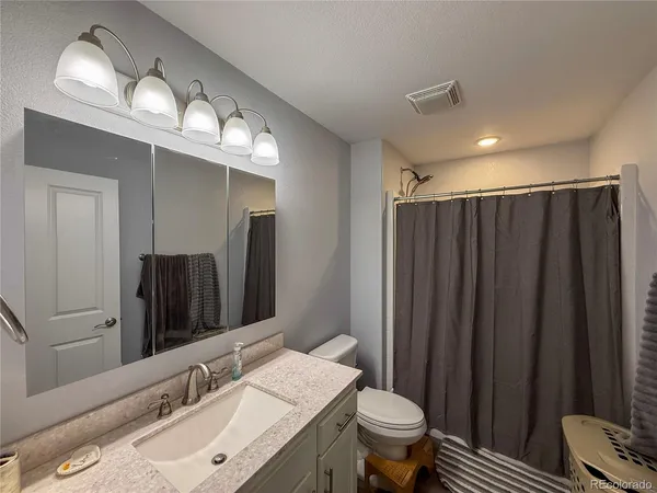 a bathroom with a shower and a shower