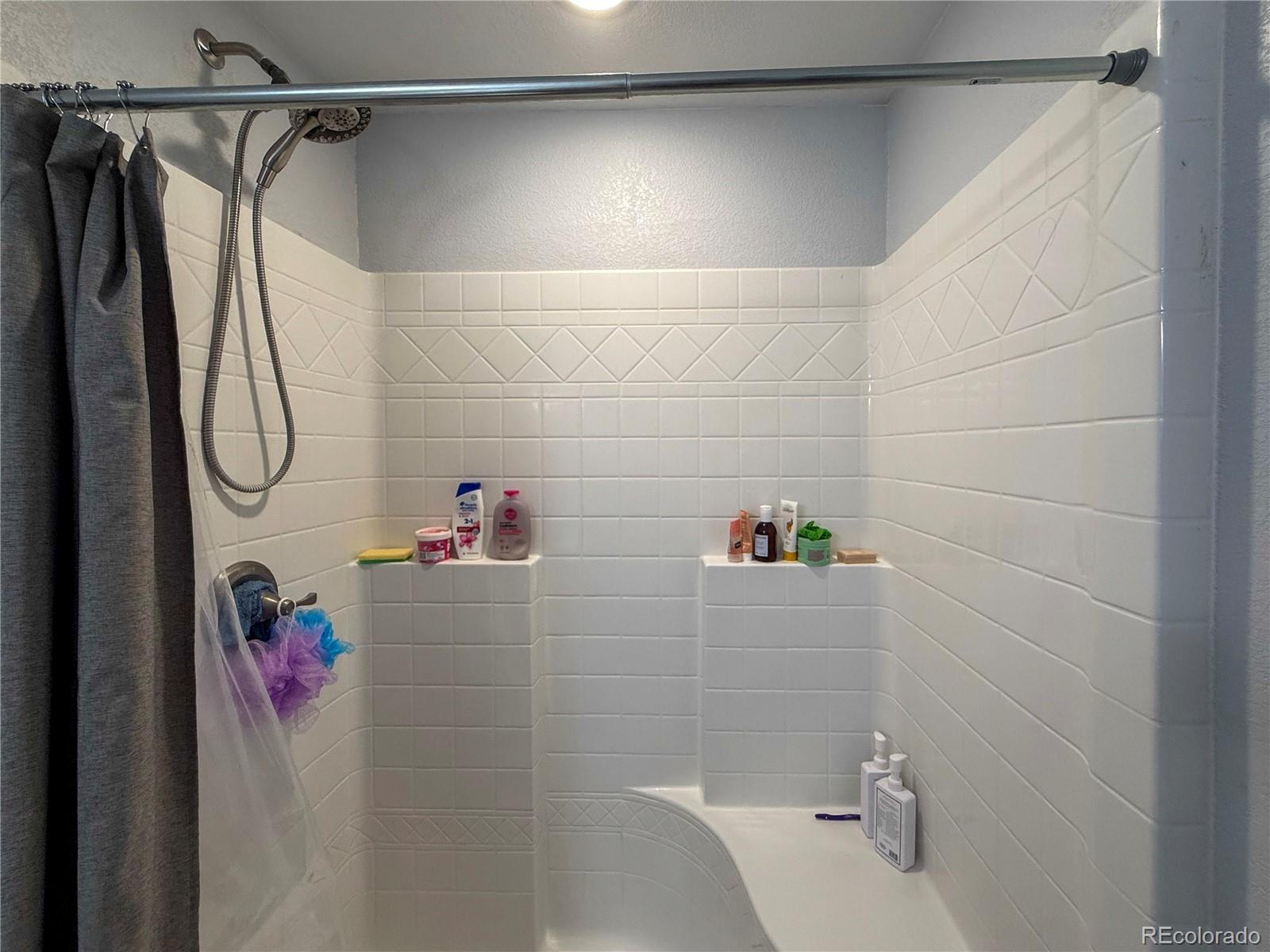 370 West 8th Street North, Unit A & B Cheyenne Wells, CO 80810 - Photo 32 of 47 a bathroom with a shower and a shower