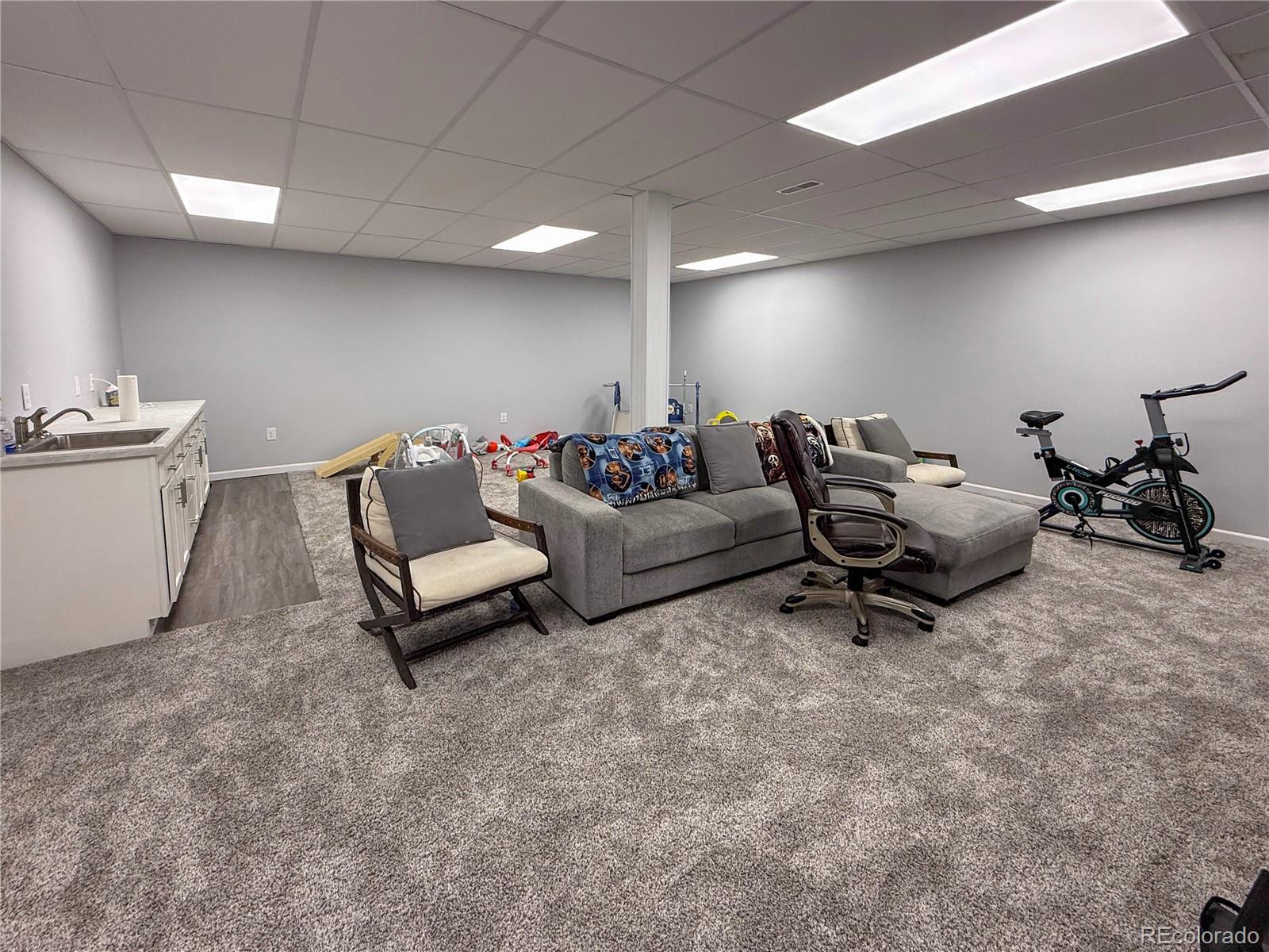 370 West 8th Street North, Unit A & B Cheyenne Wells, CO 80810 - Photo 38 of 47 a living room with furniture and a rug