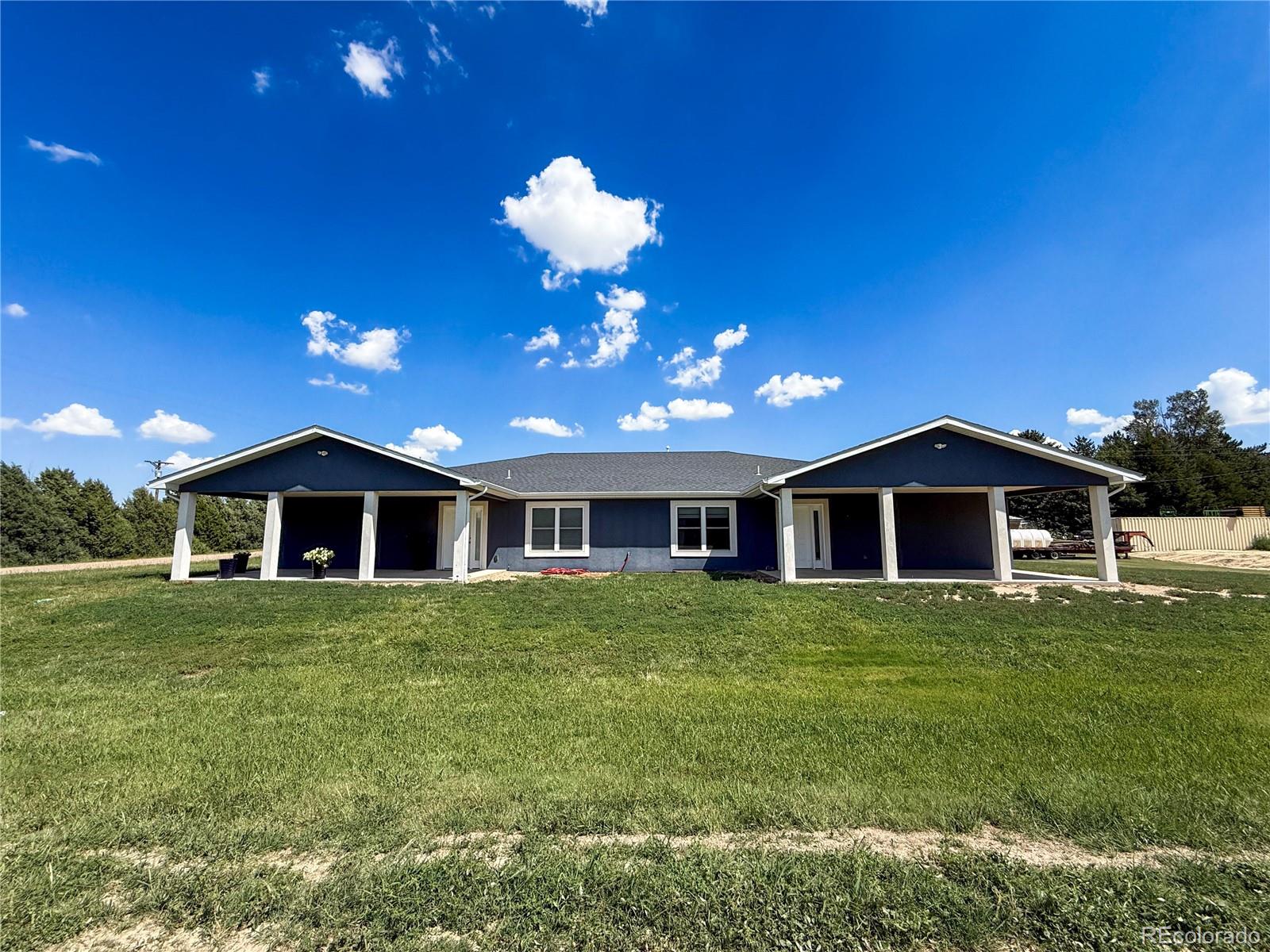 370 West 8th Street North, Unit A & B Cheyenne Wells, CO 80810 - Photo 45 of 47 a front view of a house with a yard