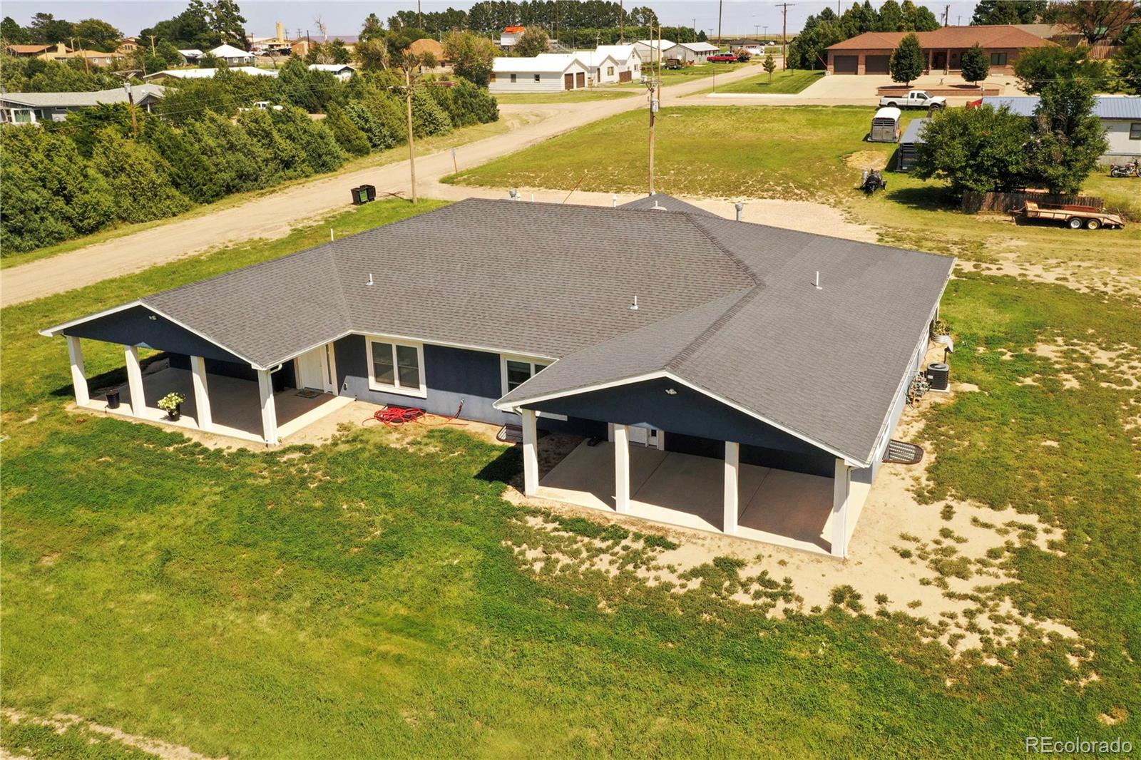 370 West 8th Street North, Unit A & B Cheyenne Wells, CO 80810 - Photo 46 of 47 an aerial view of a house with swimming pool