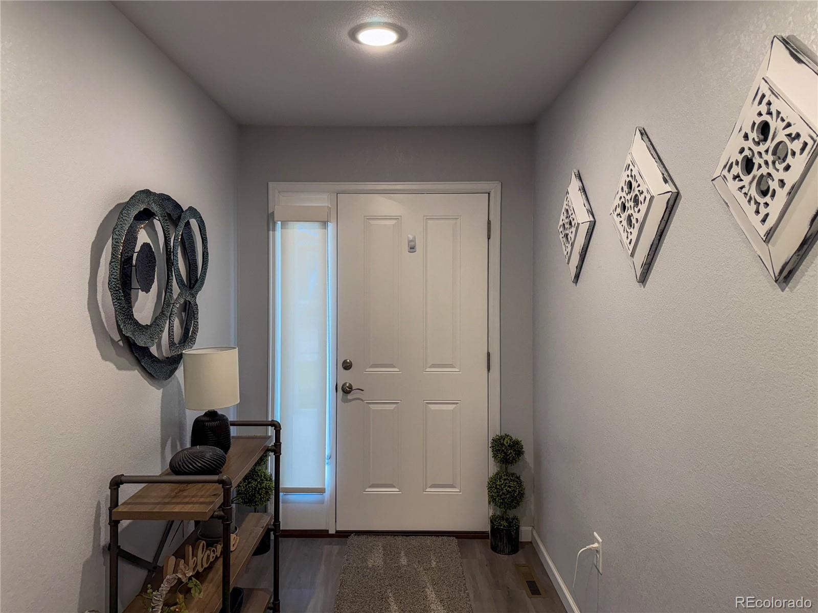 370 West 8th Street North, Unit A & B Cheyenne Wells, CO 80810 - Photo 5 of 47 a view of entryway with wooden floor