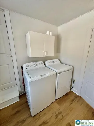 a utility room with washer and dryer
