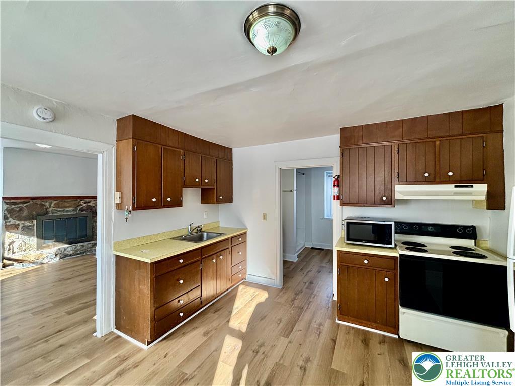 171 East Aluta Mill Road Nazareth, PA 18064 - Photo 3 of 11 a kitchen with stainless steel appliances granite countertop a stove a sink and a refrigerator