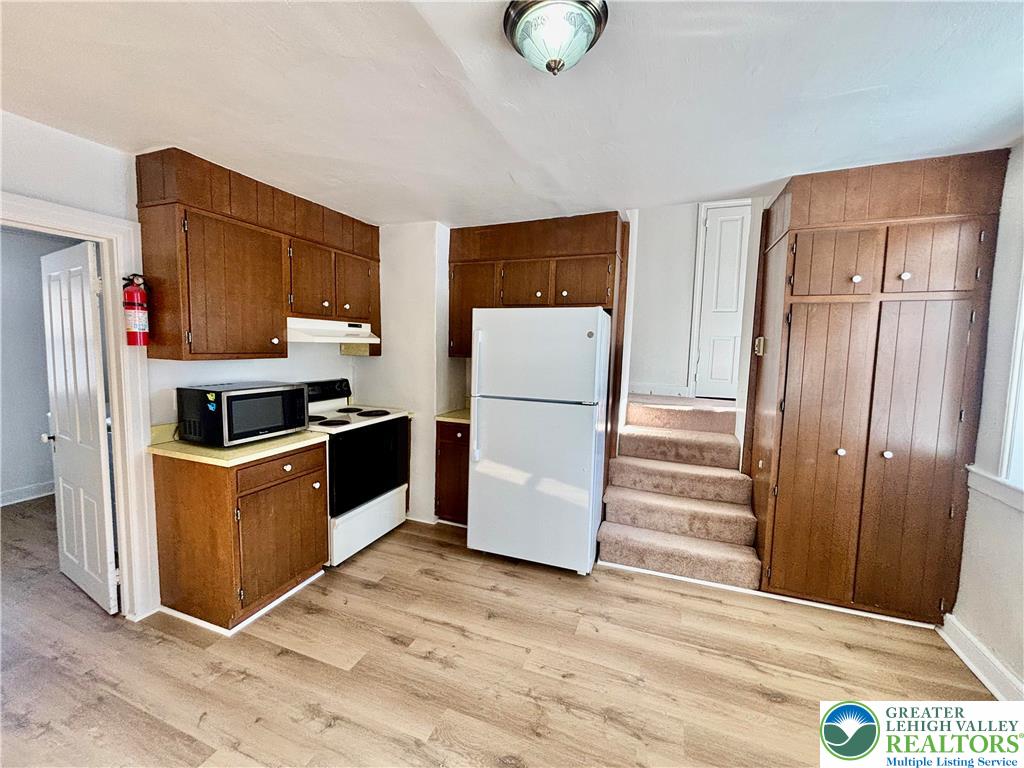 171 East Aluta Mill Road Nazareth, PA 18064 - Photo 4 of 11 a kitchen with stainless steel appliances a refrigerator and a stove top oven