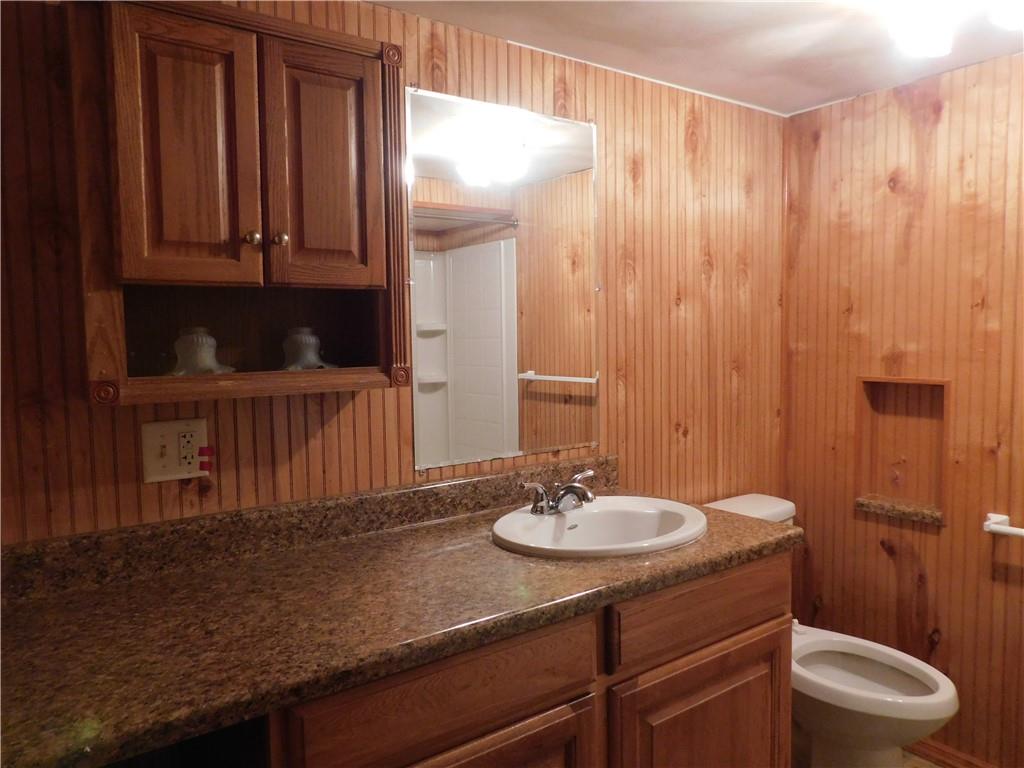 129 Herring Road Uniontown, PA 15401 - Photo 18 of 25 a bathroom with a sink a toilet and shower curtain