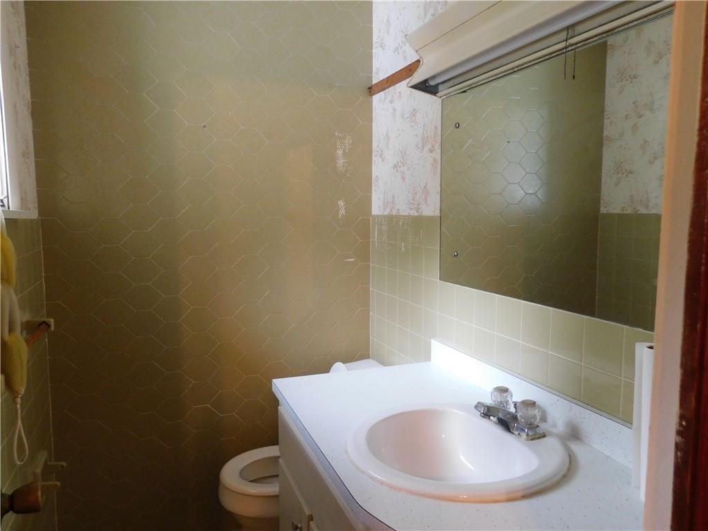 129 Herring Road Uniontown, PA 15401 - Photo 23 of 25 a bathroom with a sink and a mirror