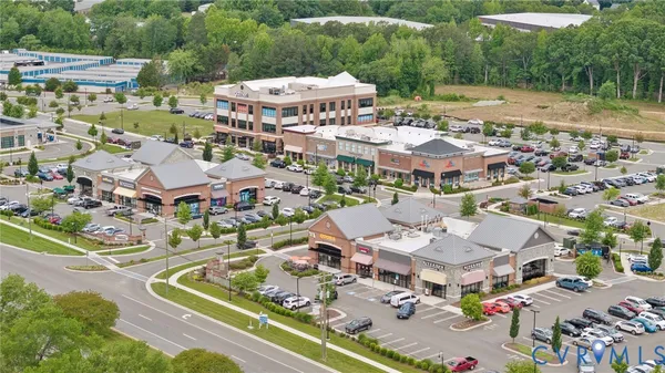 an aerial view of residential houses and outdoor space