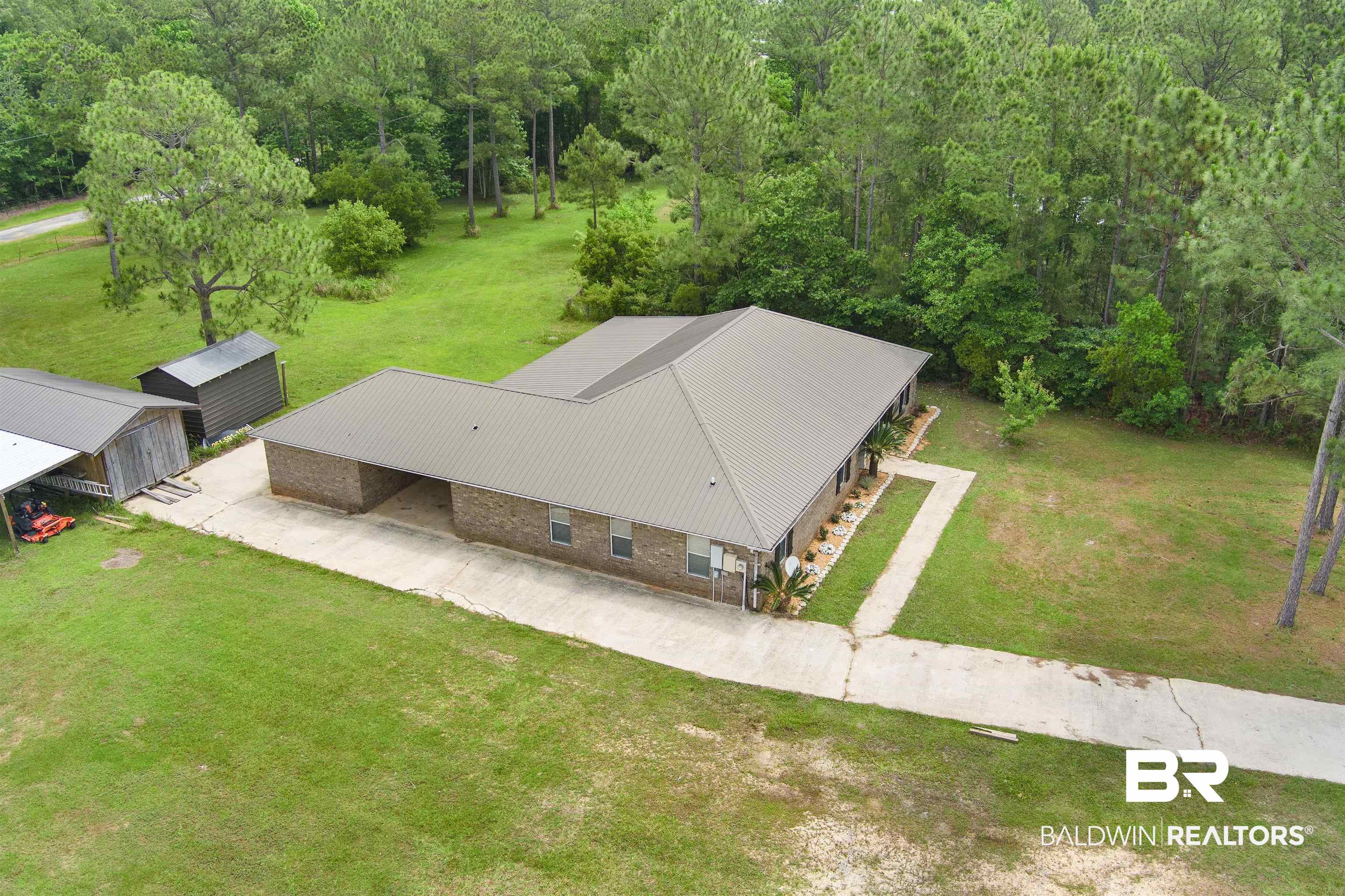 3010 Drag Strip Lane Coden, AL 36523 - Photo 44 of 44 Aerial view of property and surrounding area featuring a heavily wooded area