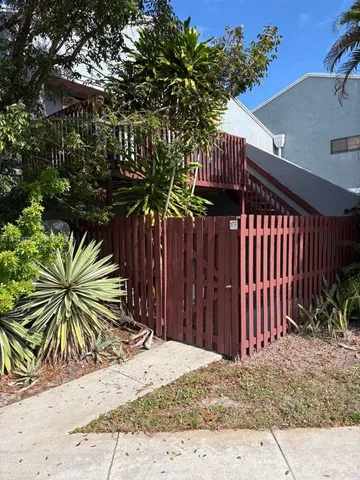 a view of a backyard of the house