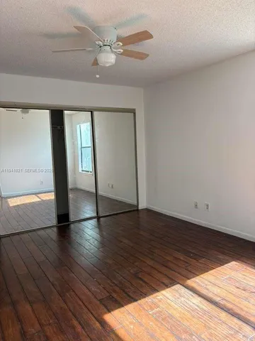 a bathroom with a granite countertop shower and a sink