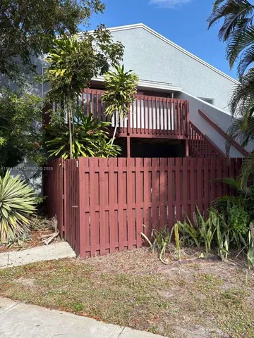 a view of a backyard with a small cabin