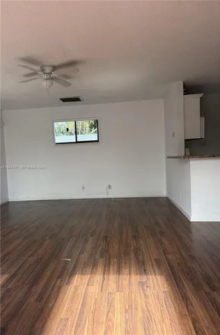 a kitchen that has a sink and a stove
