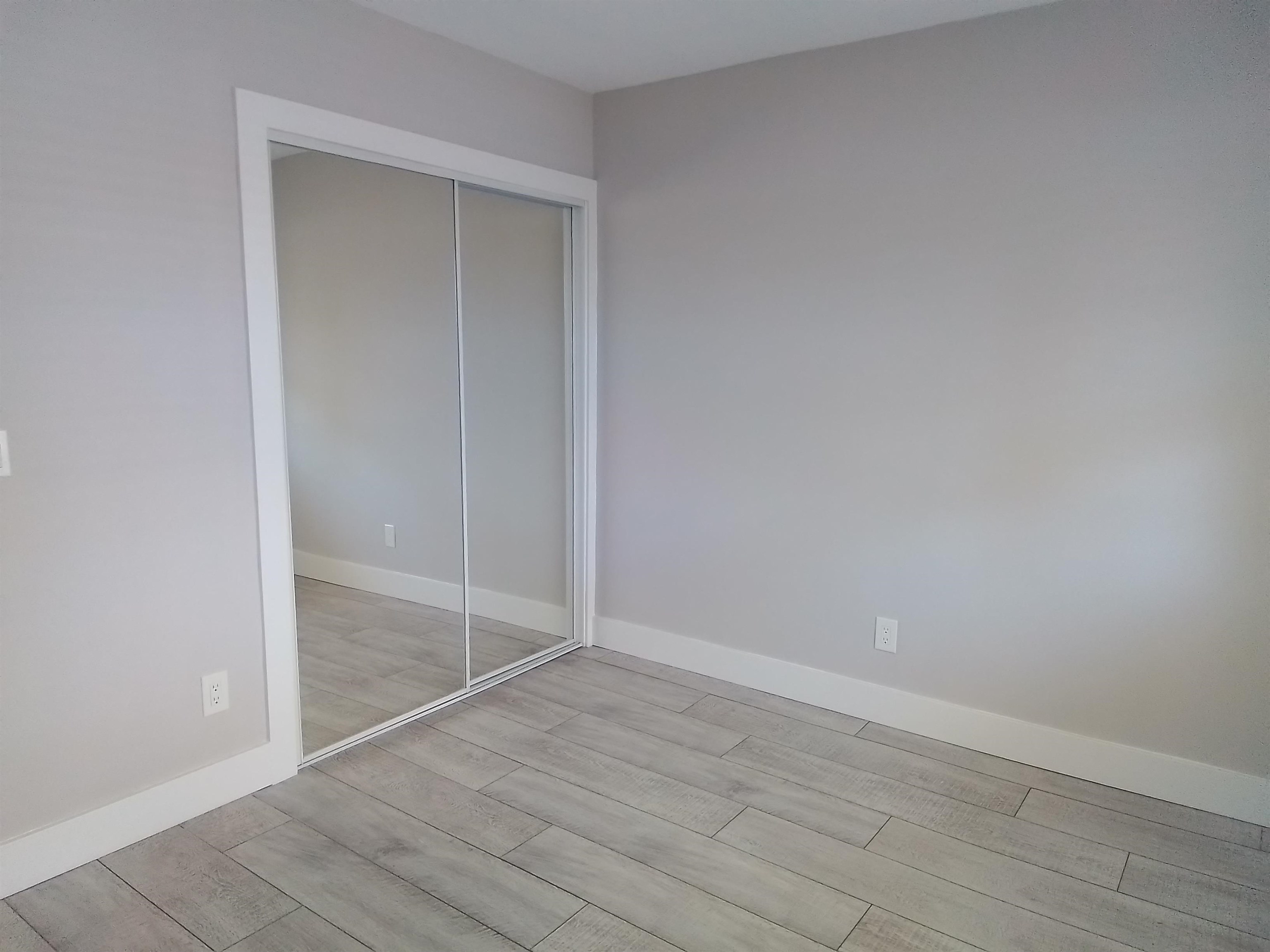 650 West Pope Road, Unit 244 St. Augustine, FL 32080 - Photo 16 of 27 an empty room with wooden floor and door