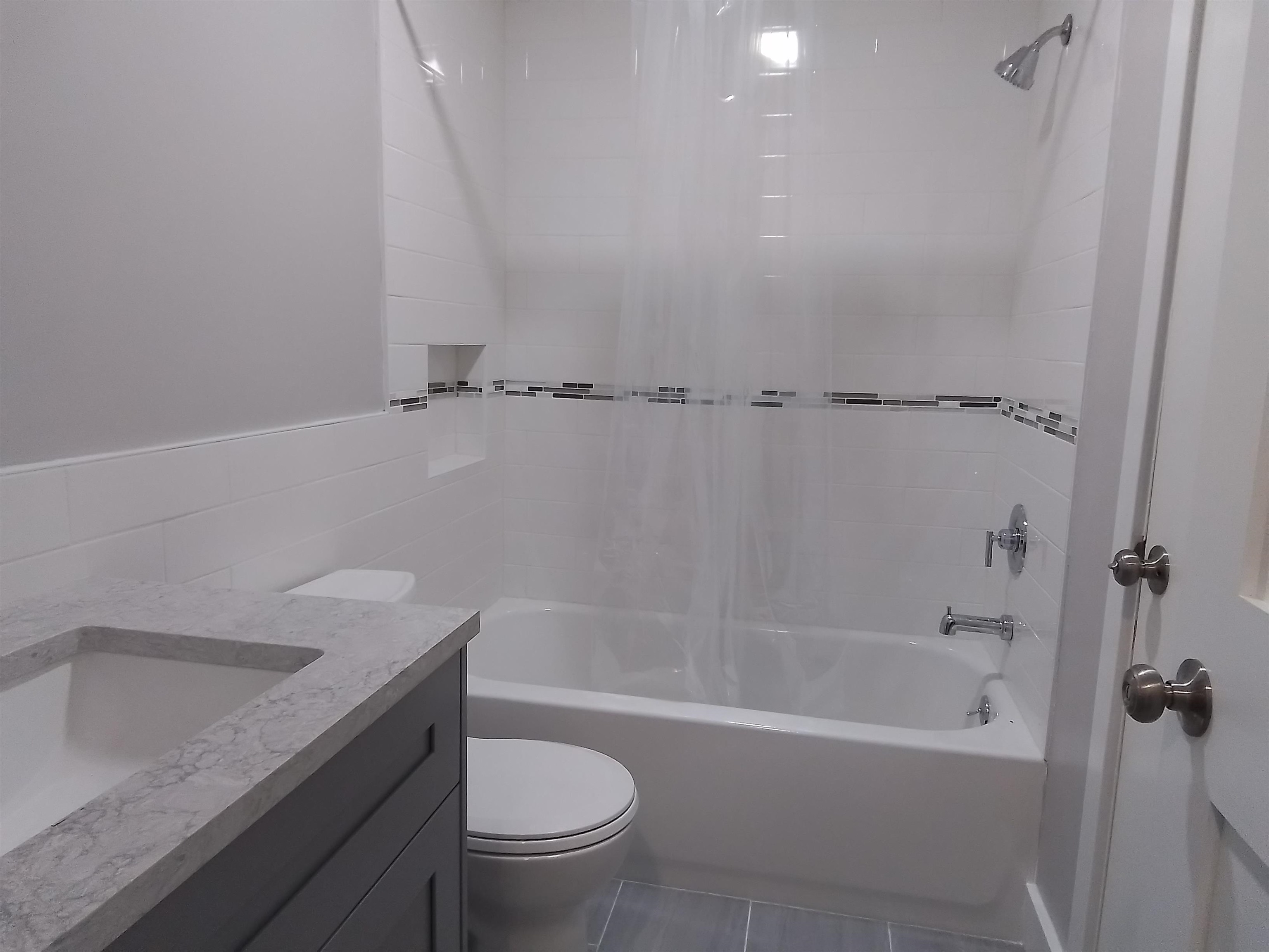 650 West Pope Road, Unit 244 St. Augustine, FL 32080 - Photo 18 of 27 a bath room with a toilet and a bath tub