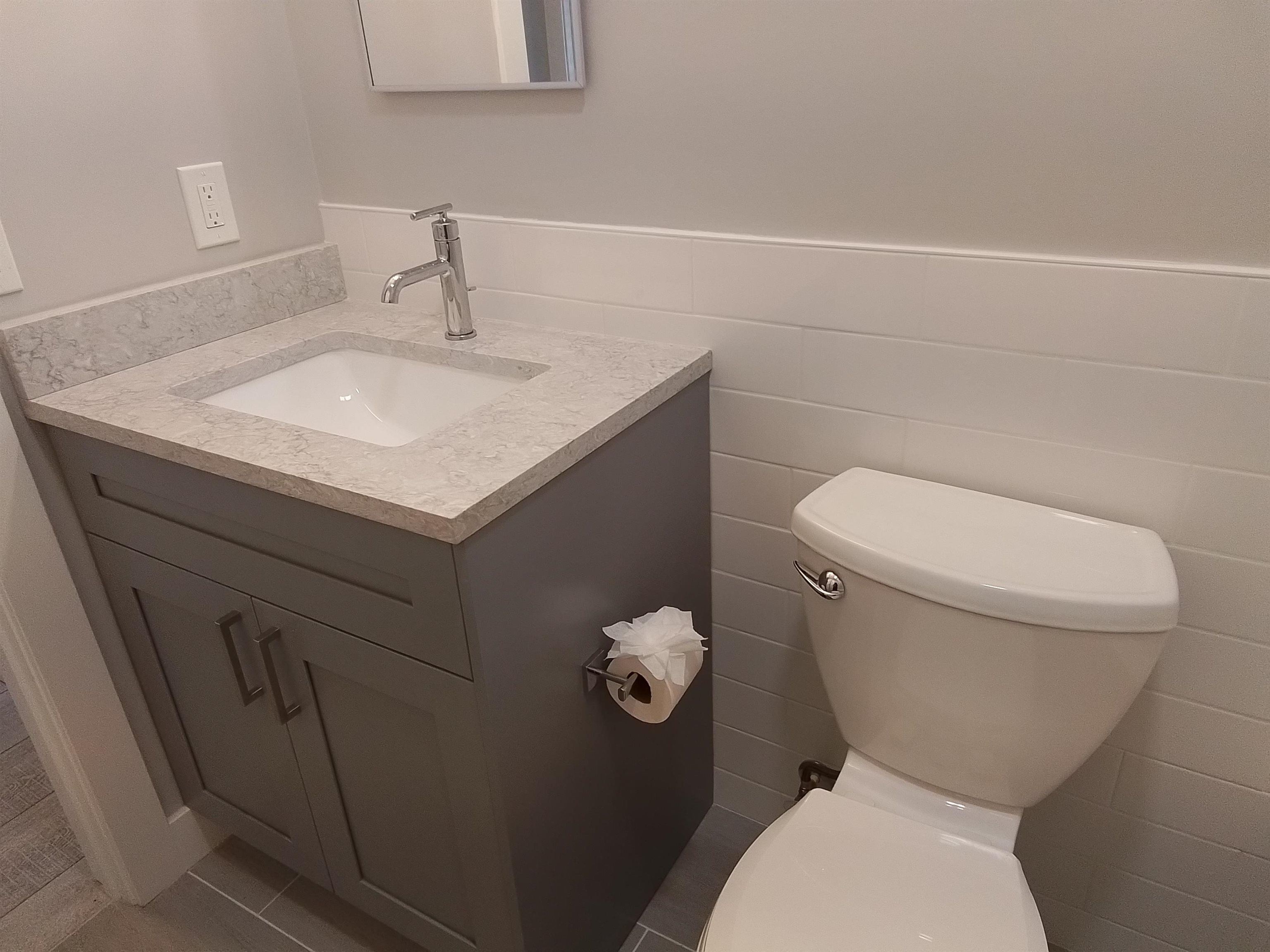 650 West Pope Road, Unit 244 St. Augustine, FL 32080 - Photo 20 of 27 a white toilet sitting next to a bathroom sink