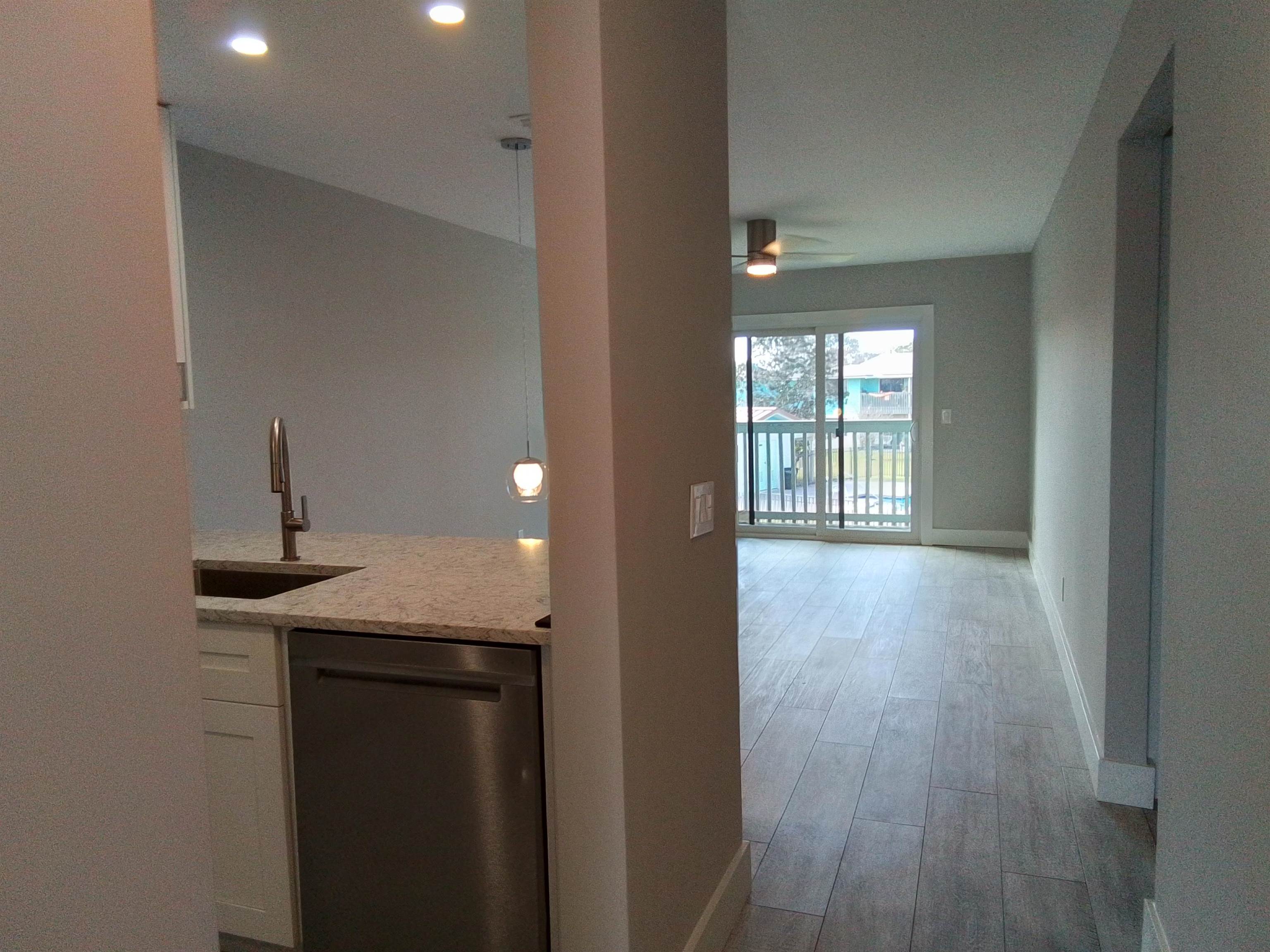 650 West Pope Road, Unit 244 St. Augustine, FL 32080 - Photo 7 of 27 a view of hallway with wooden floor