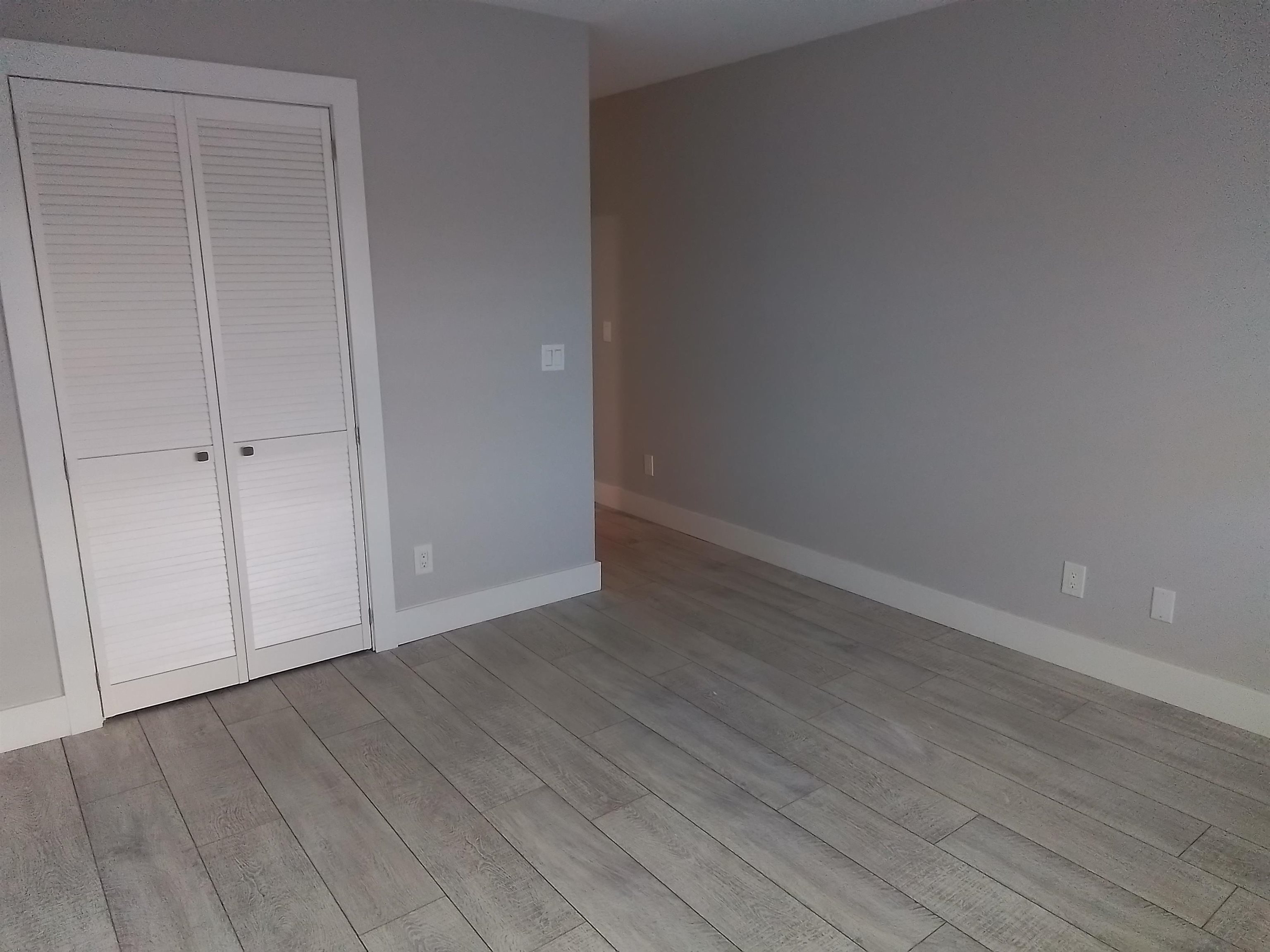 650 West Pope Road, Unit 244 St. Augustine, FL 32080 - Photo 10 of 27 a view of an empty room with wooden floor