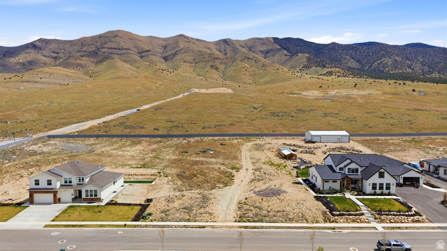 2930 Jojo Road, Unit 110 Eagle Mountain, UT 84005 - Photo 3 of 22 Overview of rural landscape featuring a mountain backdrop
