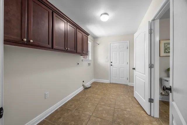 a view of a hallway to a livingroom and a couch