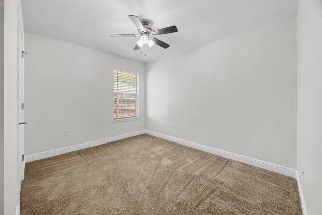 a view of a patio with a table and chairs