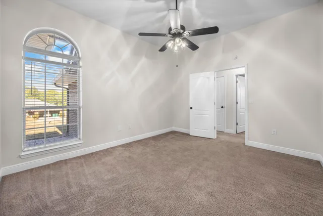 a view of a empty room with wooden walls
