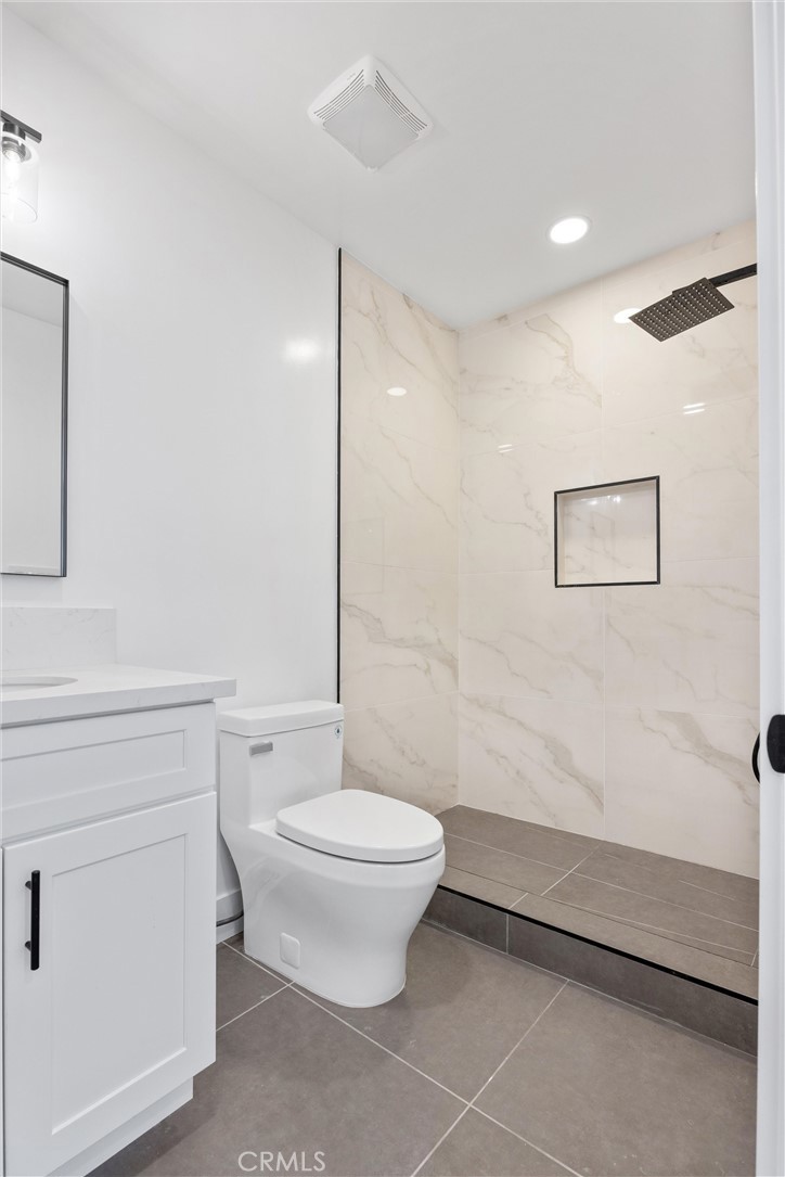 852 Orange Avenue Long Beach, CA 90813 - Photo 20 of 39 a bathroom with a toilet a sink and a shower