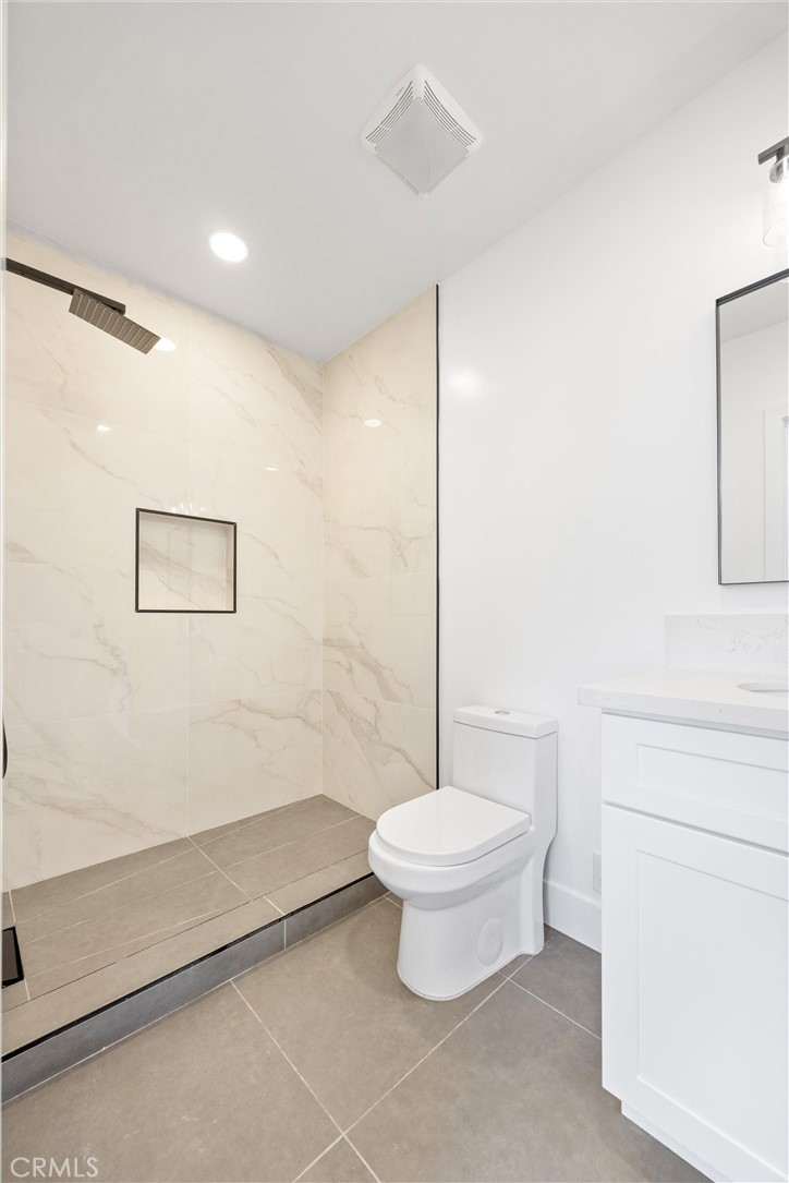 852 Orange Avenue Long Beach, CA 90813 - Photo 36 of 39 a bathroom with a toilet a sink and a shower