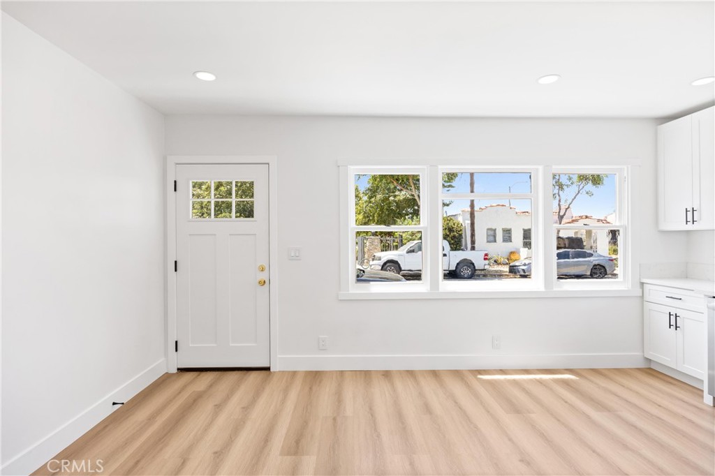 852 Orange Avenue Long Beach, CA 90813 - Photo 8 of 39 a view of a kitchen with window and wooden floor
