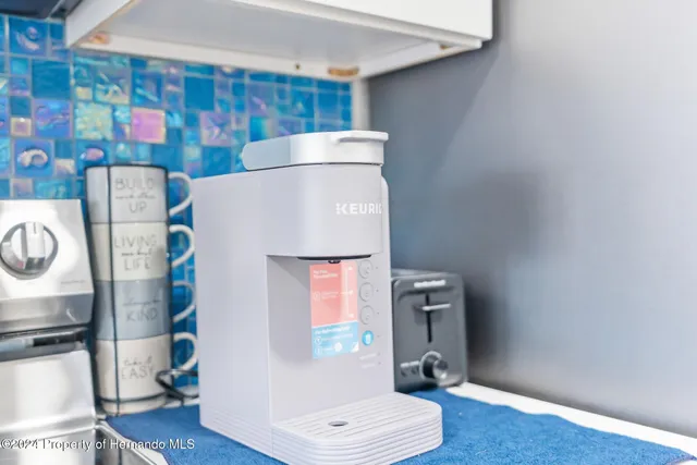 a view of storage and utility room with wooden floor