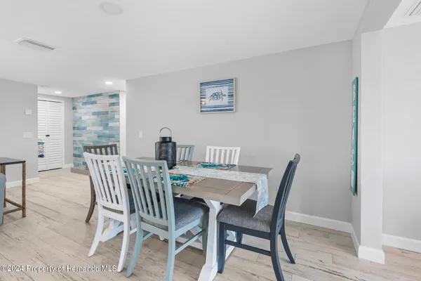 a kitchen with stainless steel appliances a stove a sink and a refrigerator